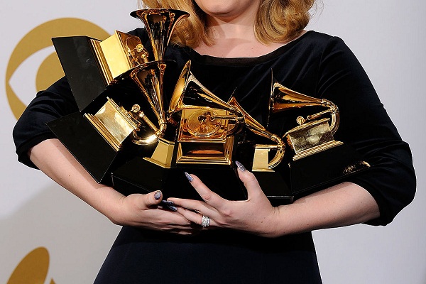 adele holding grammy awards